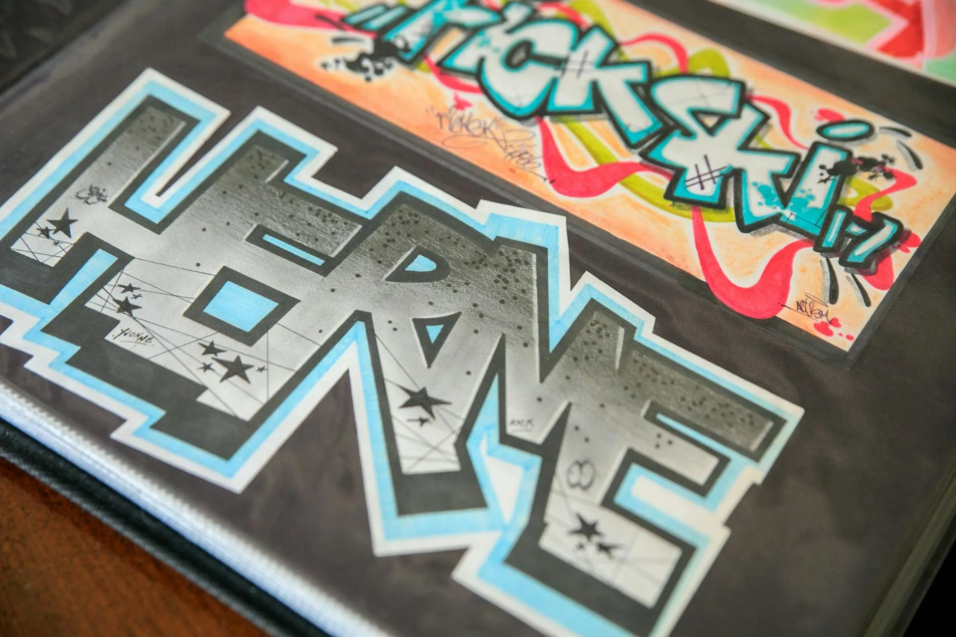 Close-up of a student's hands creating digital flashcards on a tablet amidst a messy but cozy dorm room study desk.