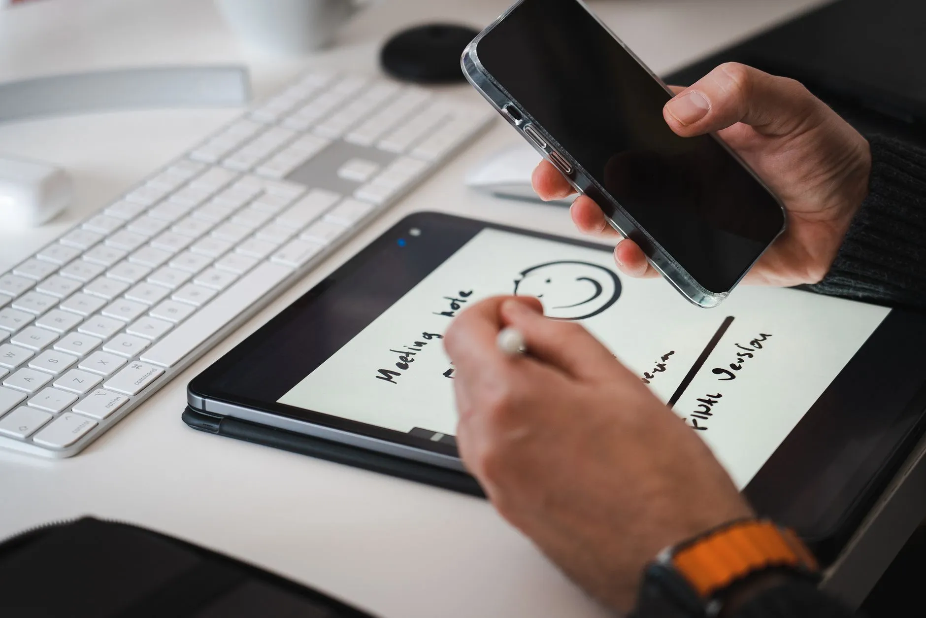 Close up of a student using a tablet to study with digital flashcards on a messy desk