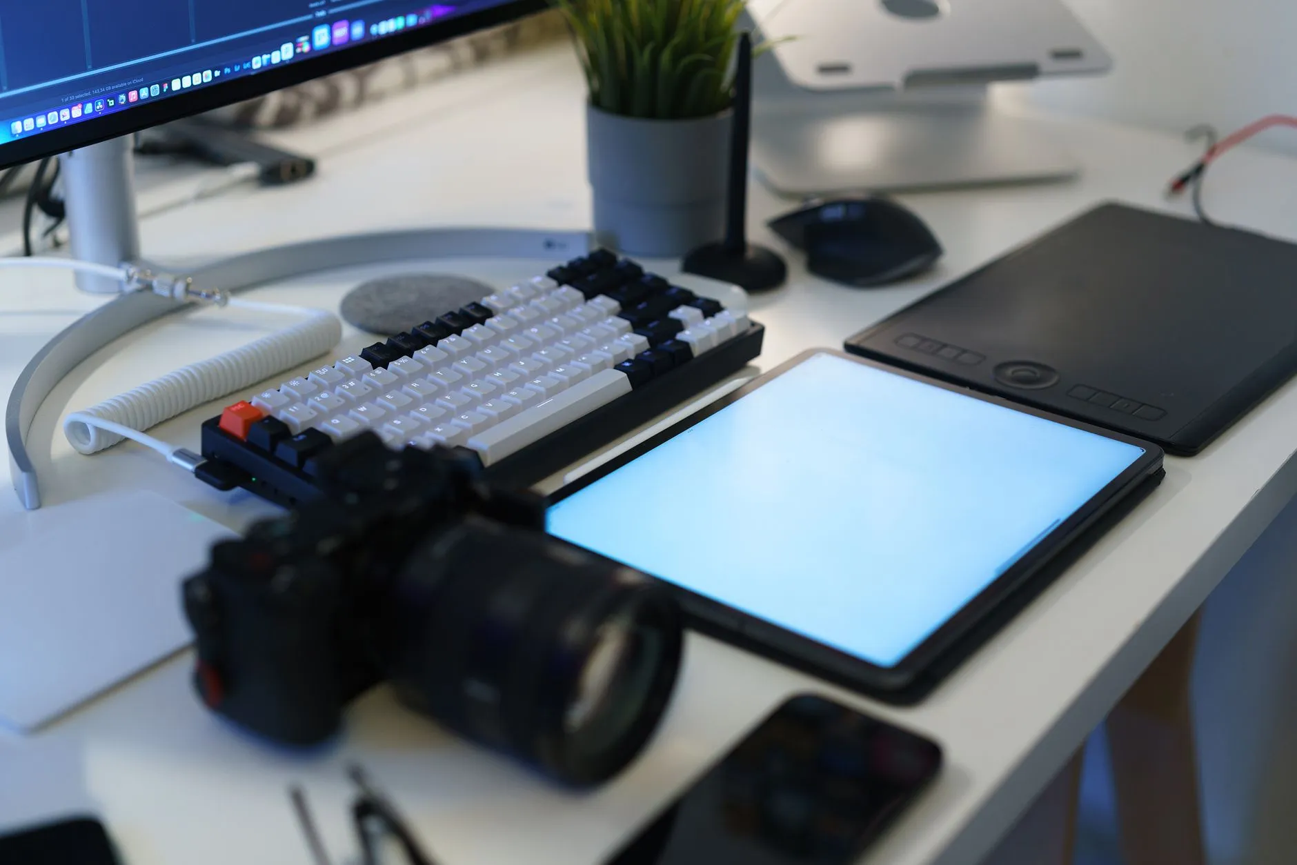 Close up of hands using a tablet to make digital flashcards on a messy dorm desk