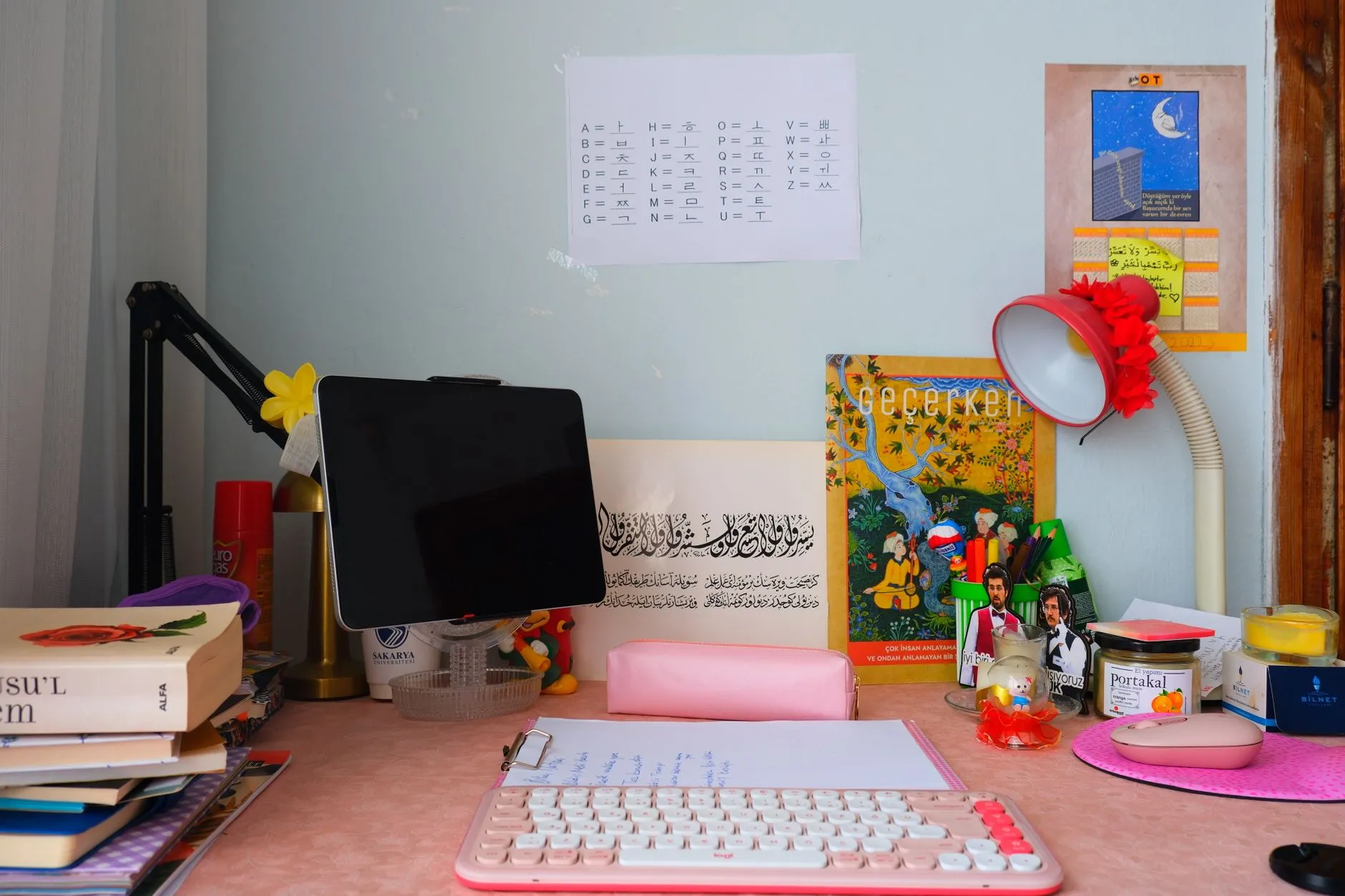A close-up shot of a messy study desk with a tablet displaying open PDF notes and digital highlights