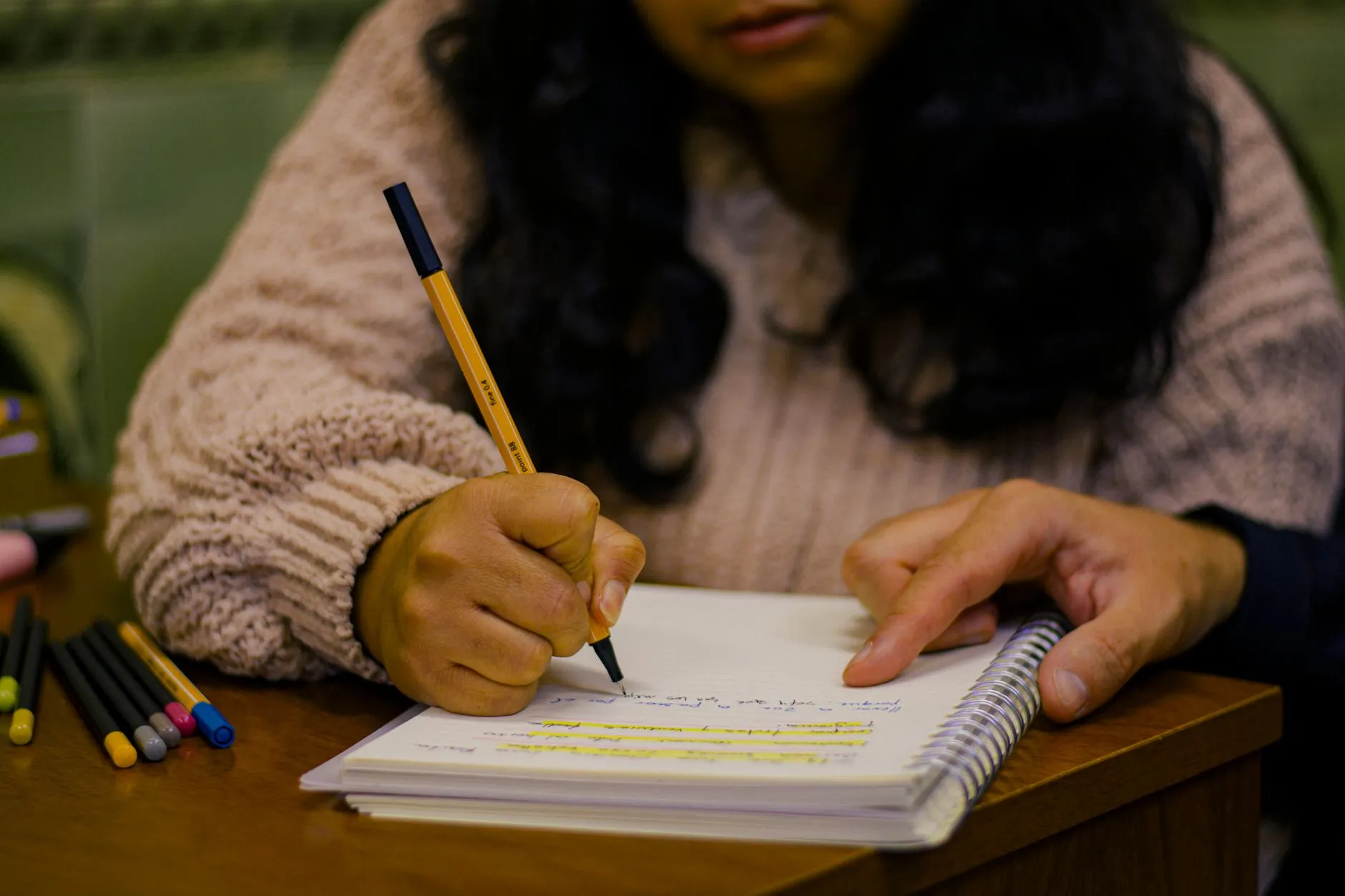 Close up of student reviewing digital notes on modern tablet