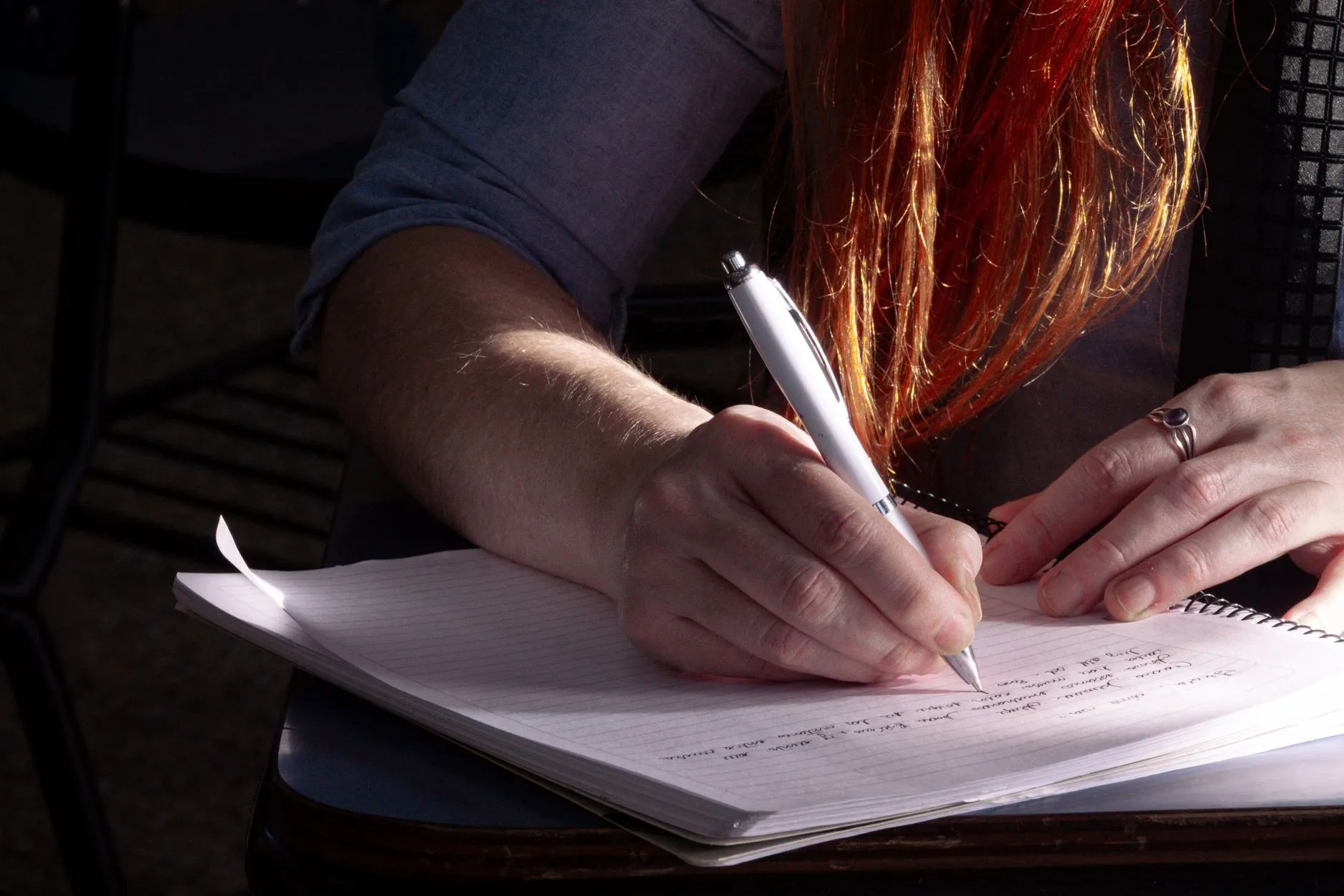 Student studying with digital flashcards on a tablet at a dorm desk