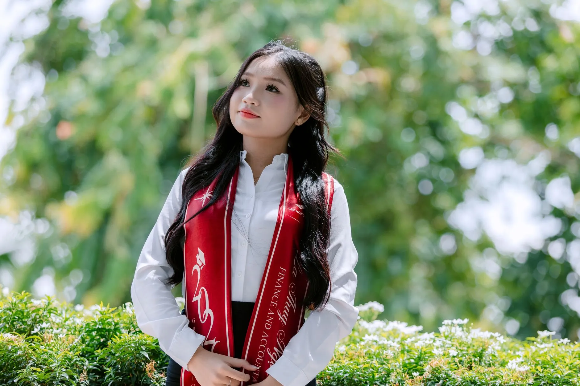 A university student walking across campus grounds after receiving unconditional admission