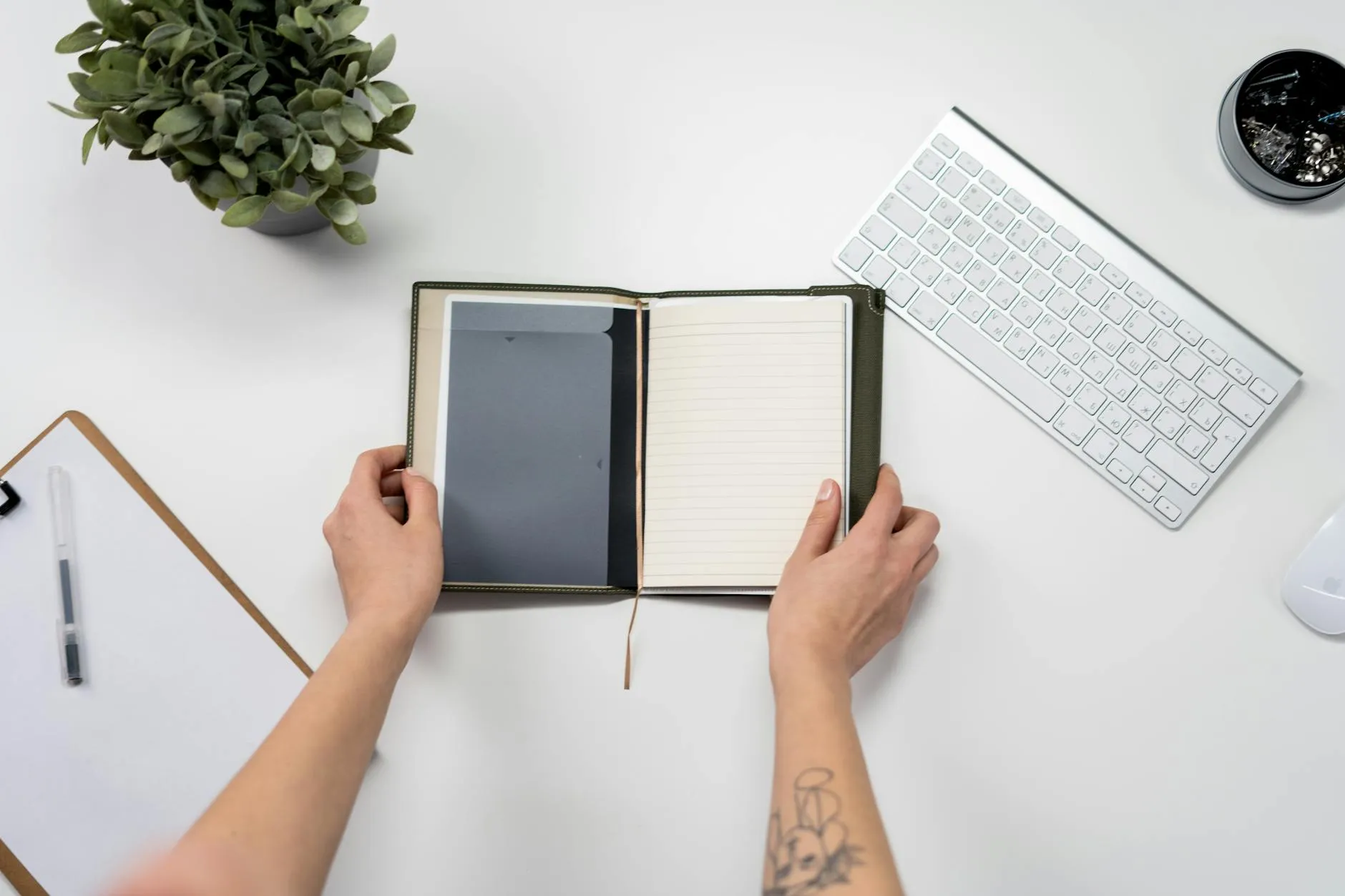 Close-up of student's hands interacting with an AI document summarization tool on a tablet, surrounded by notes on a messy dorm desk.