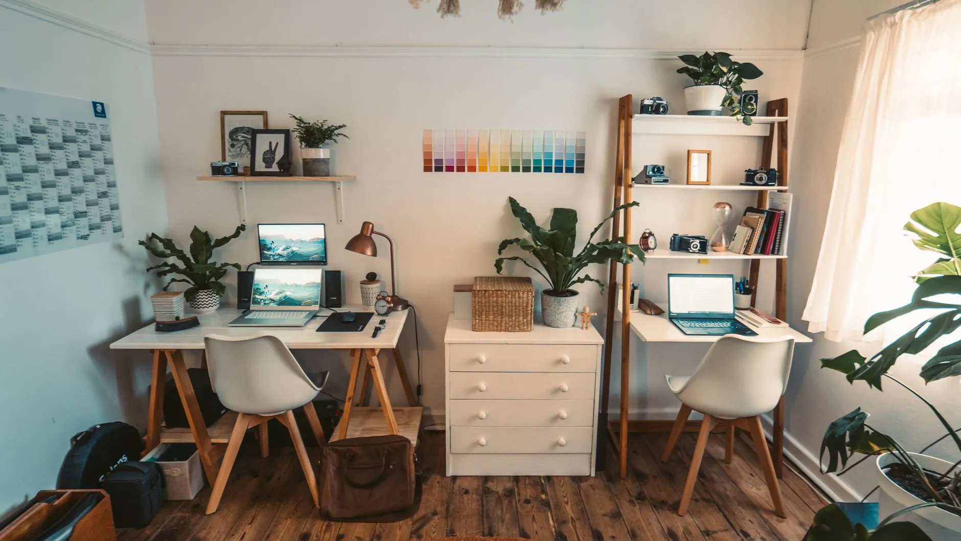A cozy student dorm room desk with a laptop, notebook, and a warm cup of coffee in the morning light