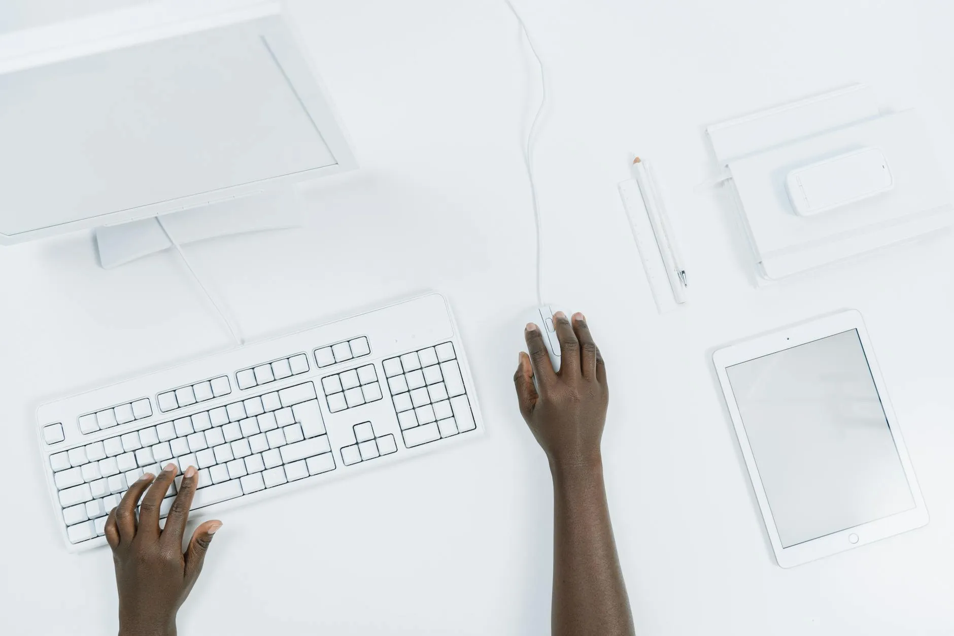 Close up of student hands using a tablet to study with digital flashcards on a messy dorm desk