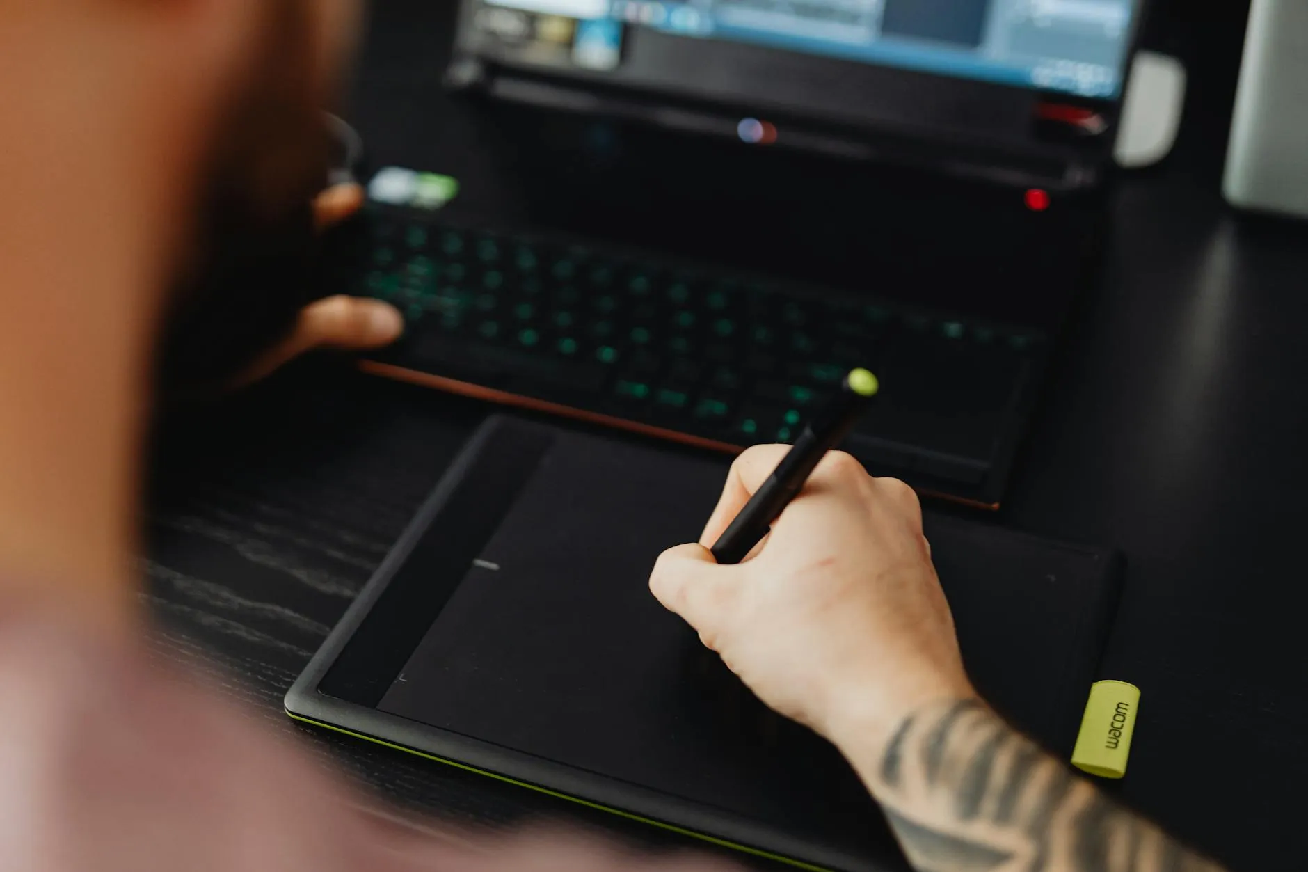 Close up of hands using a tablet to study on a messy dorm room desk