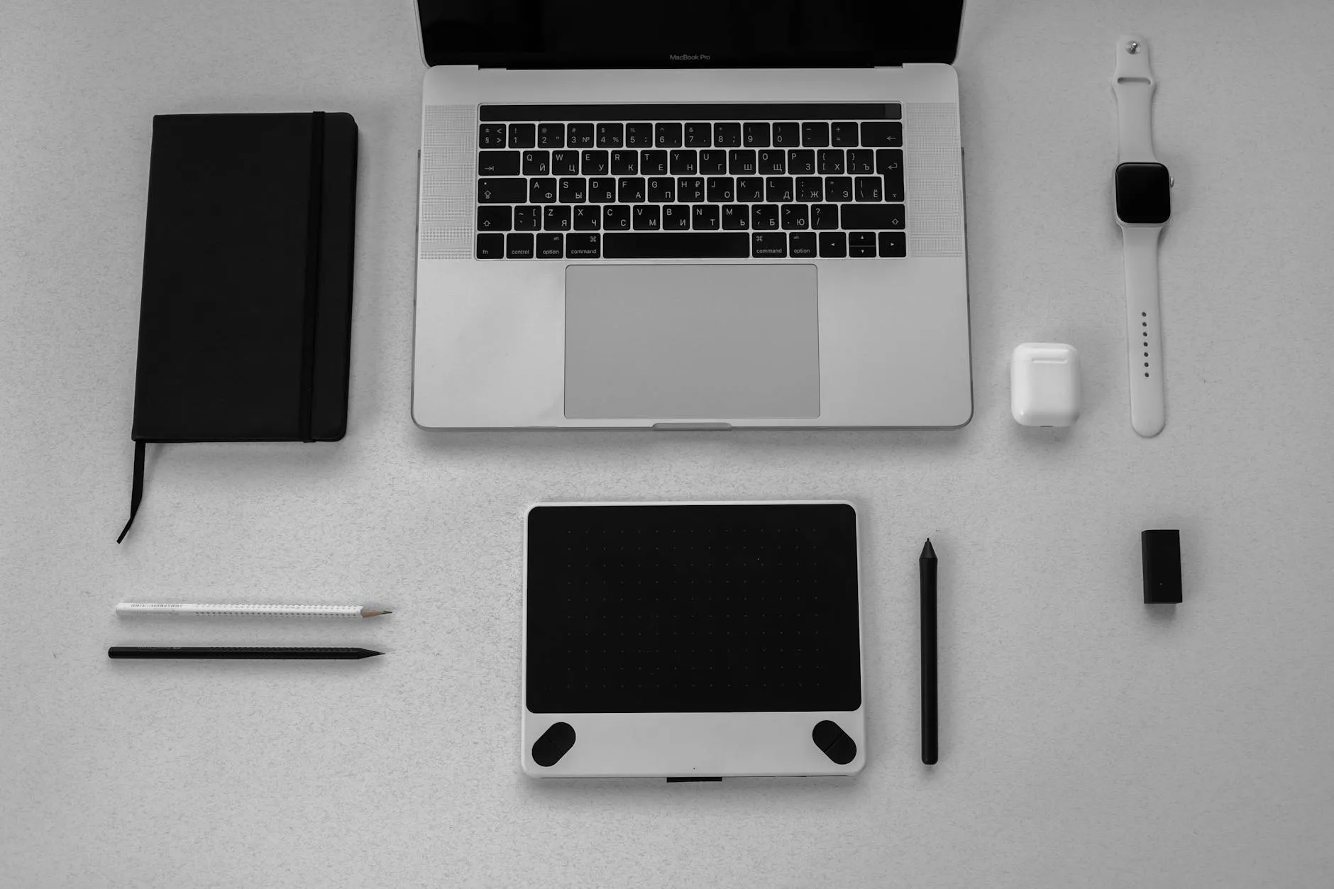 Close-up of hands typing on a tablet with an AI study tool on a messy dorm desk