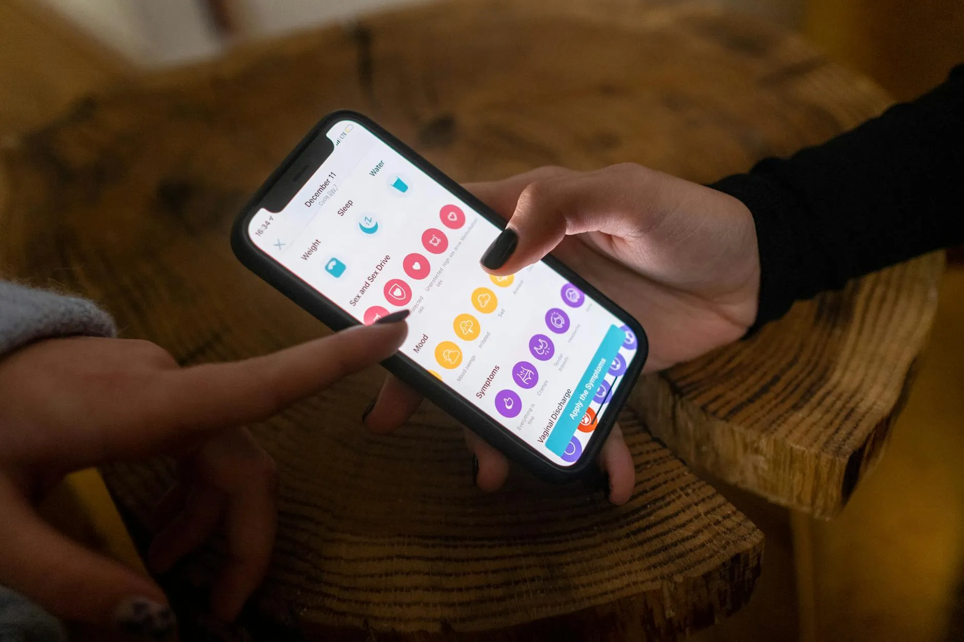 A student using a mobile study app to review flashcards in a modern university library