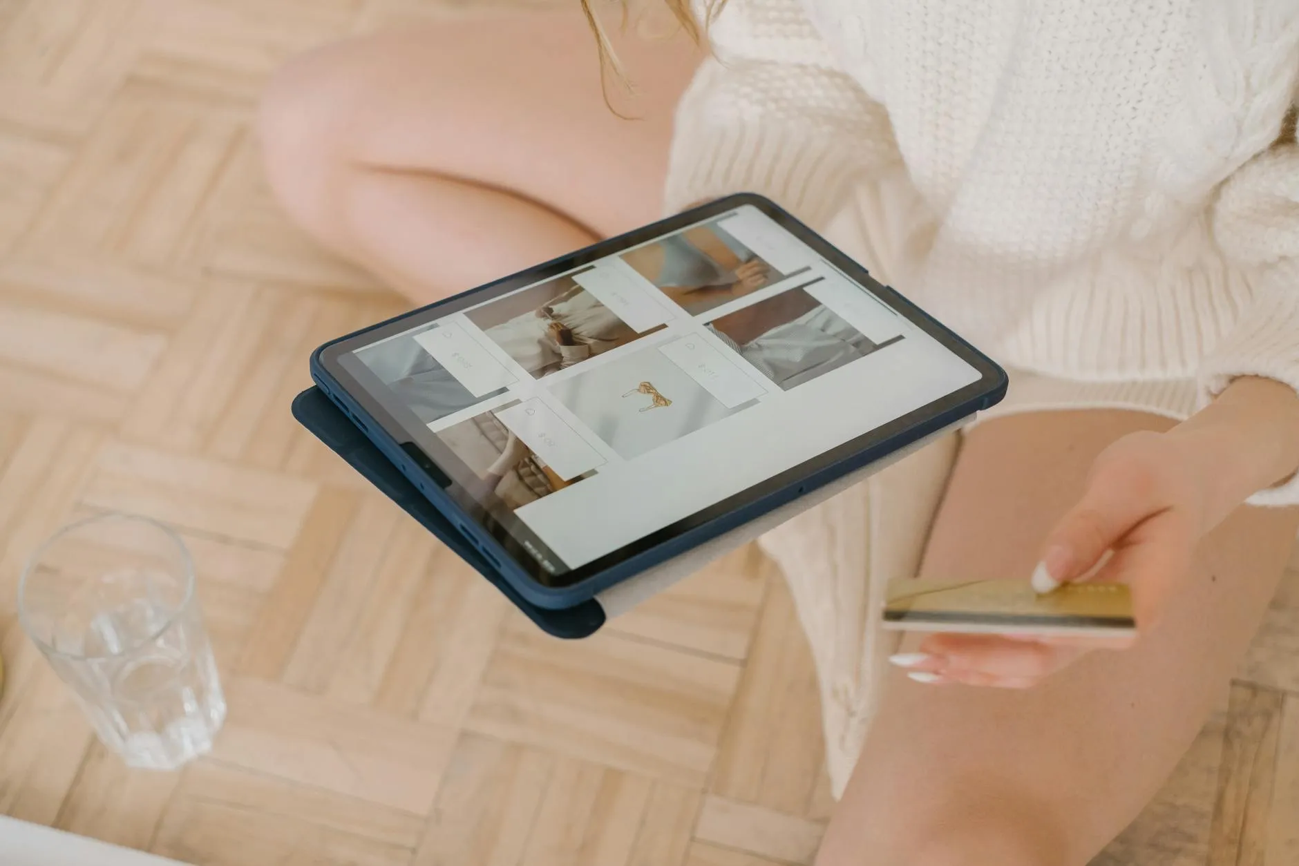 Close up of a student using a tablet for studying in a modern library during blue hour