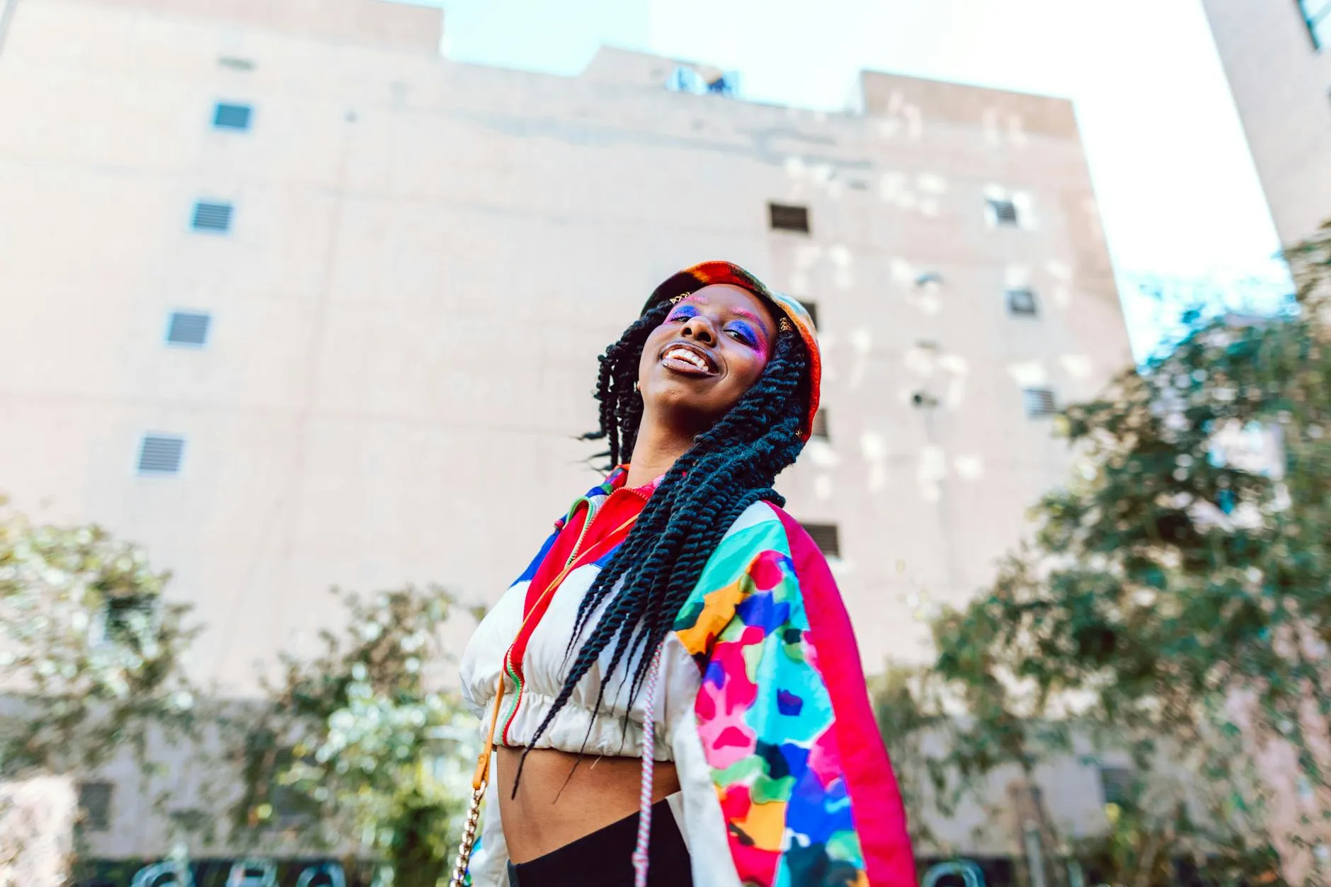 An overwhelmed Gen Z student studying late at night in a messy dorm room, surrounded by books and a laptop.