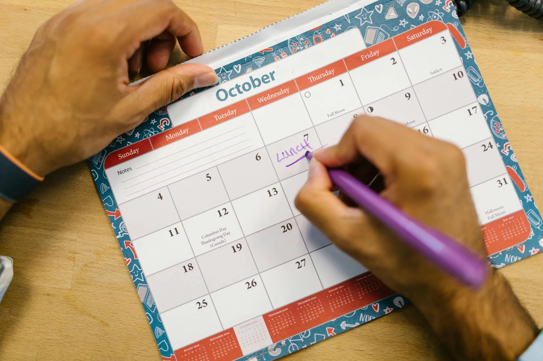 Detailed shot of a student color-coding their weekly study schedule