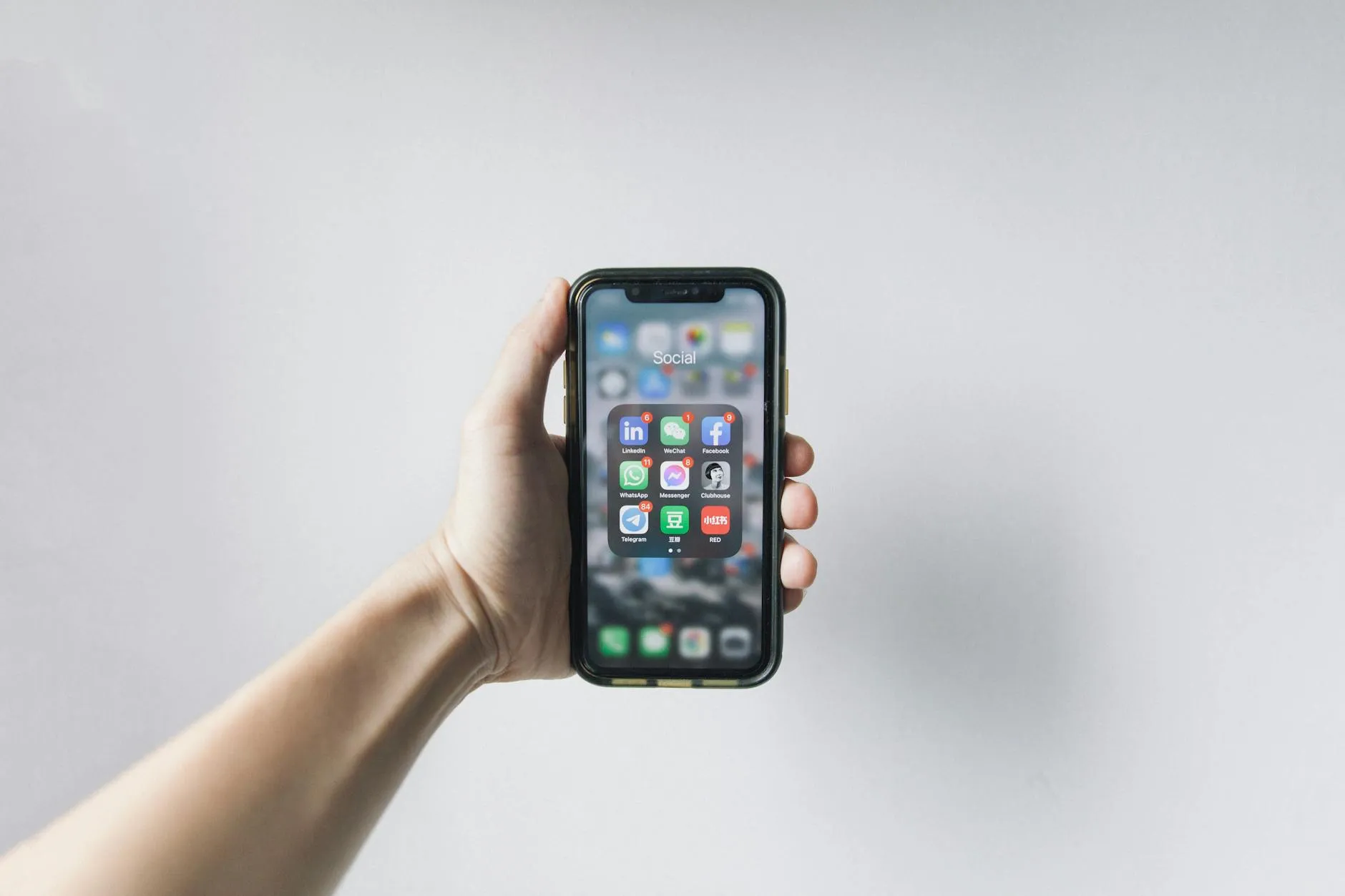 Close up of a student using a study app on their phone in a modern university library