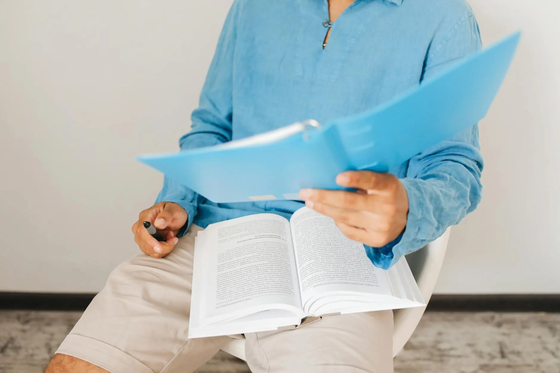 Close up of hands using a tablet to study active recall flashcards in a university library