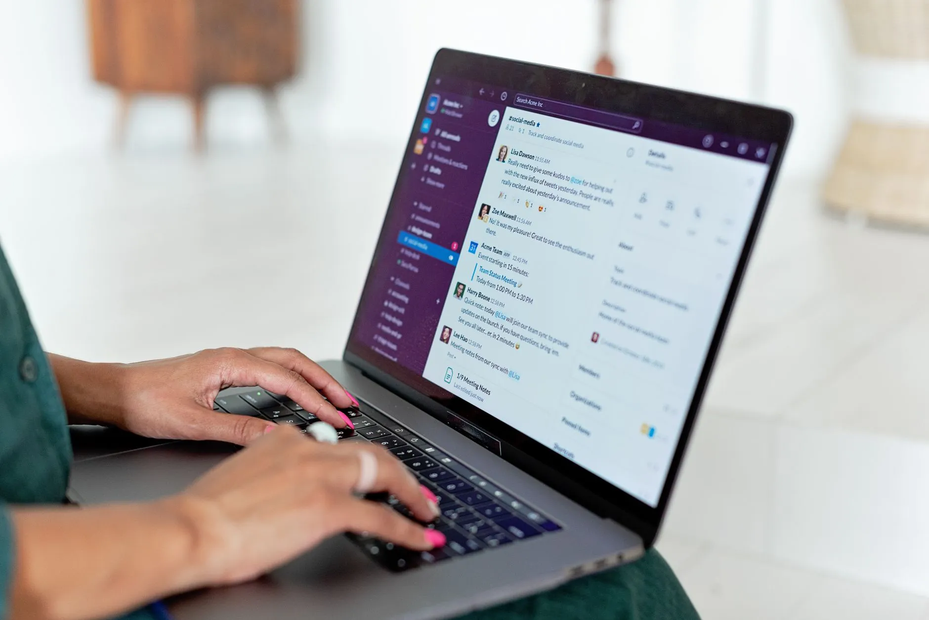 Close up of hands typing on a laptop screen displaying digital flashcards in a library