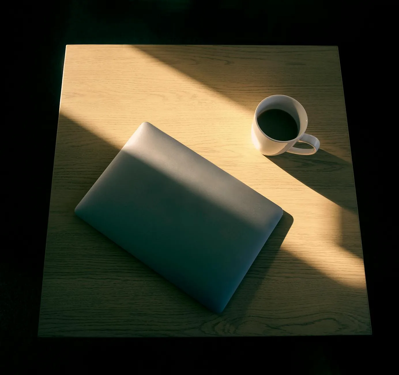 A stressed Gen Z student at a messy desk with empty coffee cups, studying late into the night.